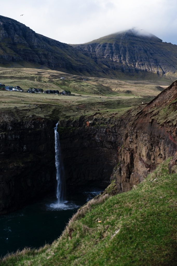 A mountain and waterfall in the Faroe Islands on Vágar